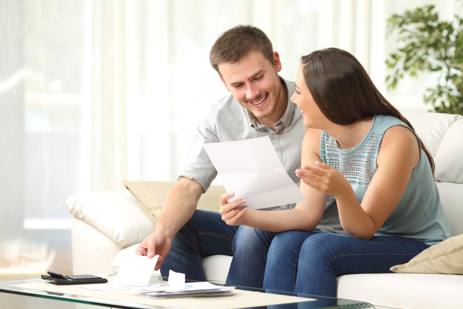 Couple reading a mortgage notice of default at home