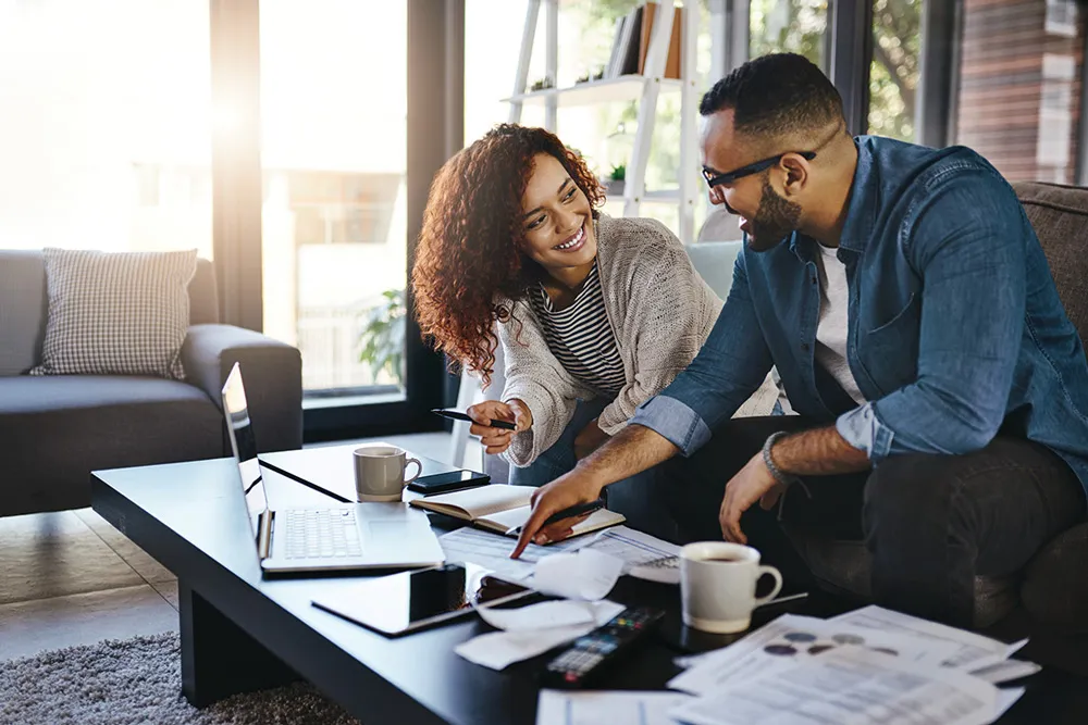Couple meeting an advisor about loan modification vs short sale