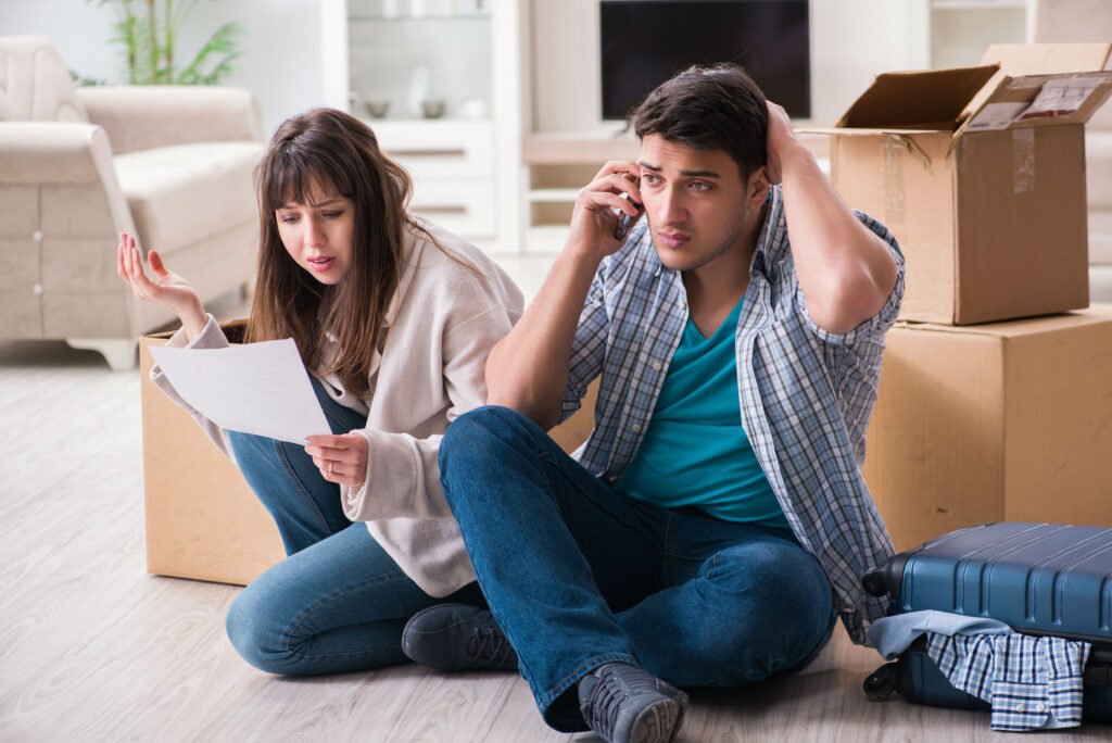 Couple on the phone about being behind on mortgage payments