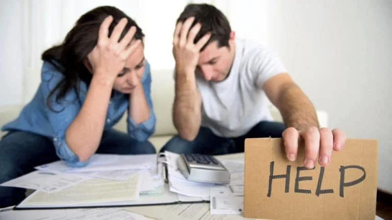 Stressed homeowner dealing with divorce and foreclosure